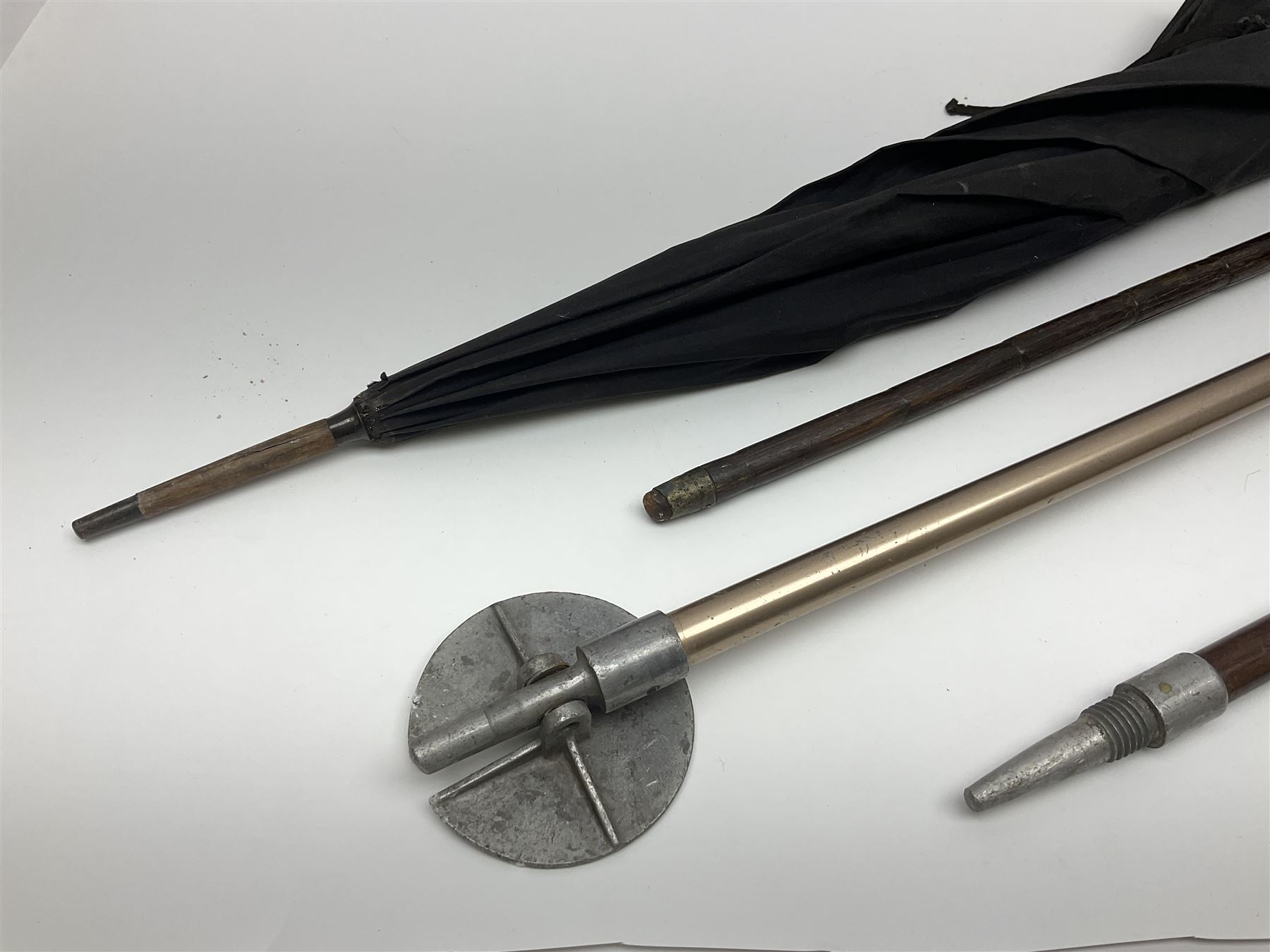 Early 20th century curved horn handle walking stick with hallmarked silver mounts, engraved L Russell 1918, together with a shooting stick by William Mills Birmingham, with leather handle, 'The Featherwaite' shooting stick and an umbrella with wooden handle
