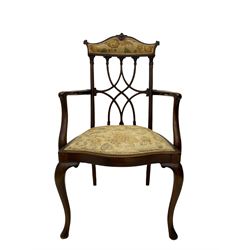 Edwardian walnut open armchair, raised shaped cresting rail over interlacing back with carved capitals, upholstered serpentine seat, on cabriole supports