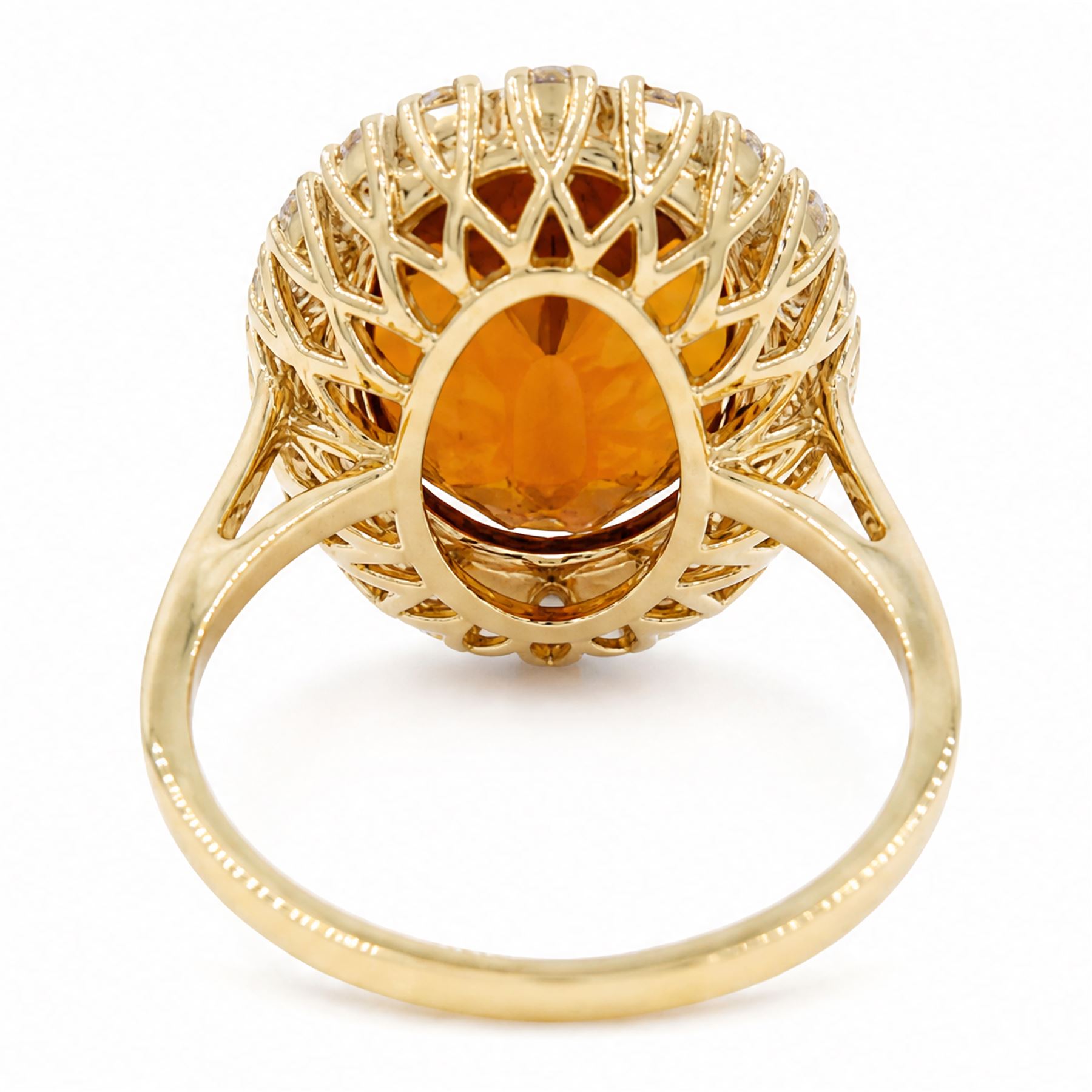 18ct gold citrine and diamond cluster ring, single oval cut citrine of approx 6.90 carat, surrounded by twenty round brilliant cut diamonds, stamped, total diamond weight approx 0.60 carat