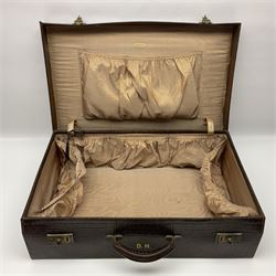 Finnigans of Manchester & Liverpool crocodile skin suitcase, stamped with initials DH, together with cased silver dressing table set, hallmarked F H Adams & Co, Birmingham, 1927