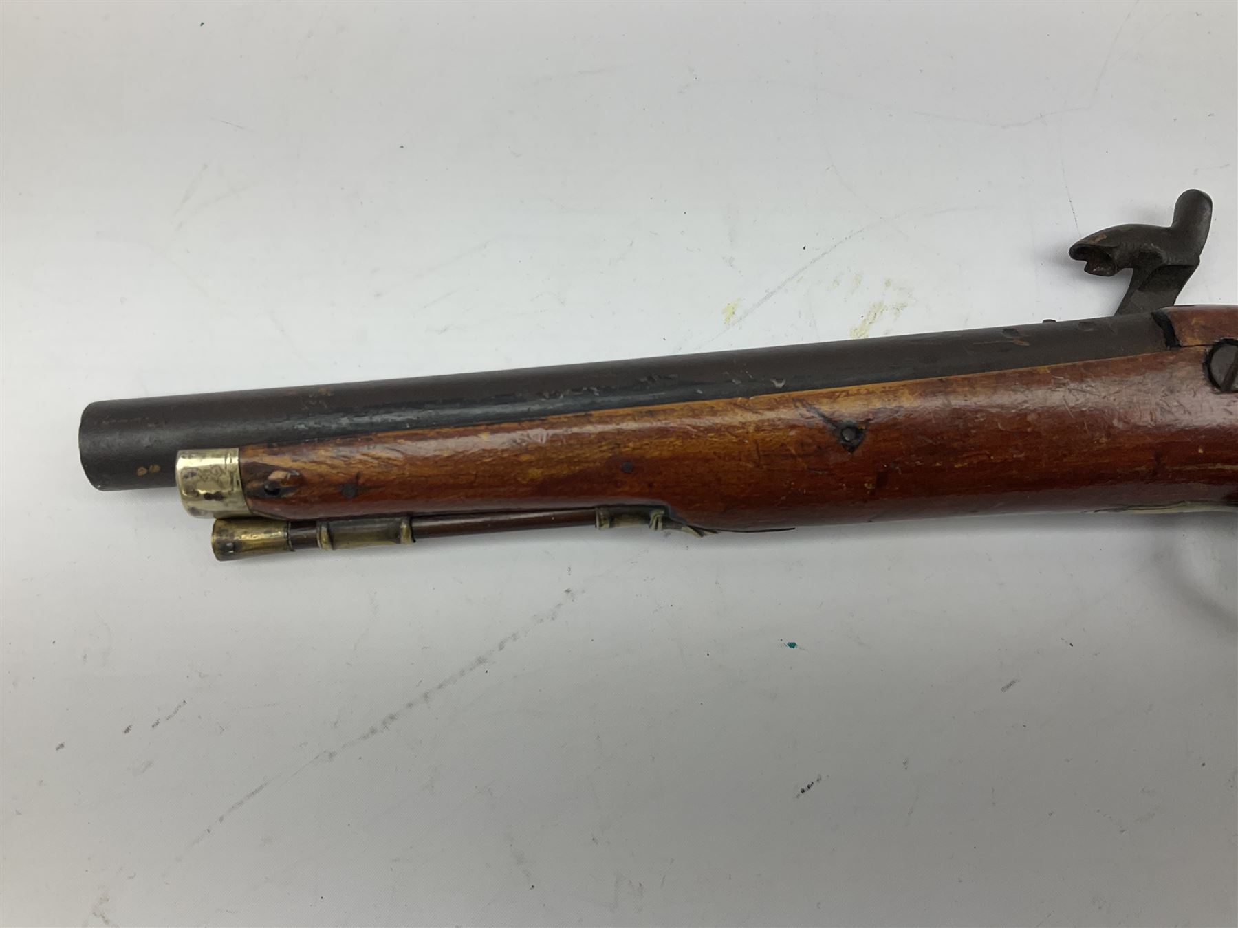 Re-manufactured percussion converted from flintlock single barrel pistol, the 20cm barrel with ramrod under, reused back action lock, brass furniture and hardwood stock L41cm overall
