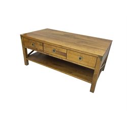 Rectangular hardwood coffee table, fitted with three drawers over under-tier
