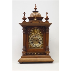  Early 20th century walnut mantel clock, architectural case, gadroon dome top with turned finials, single bevel glazed door with tapering reeded columns, stepped ogee base, twin train movement striking the hours and half on coil, H52cm  