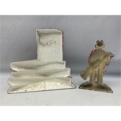 Five cast metal and painted doorstops including golfer etc