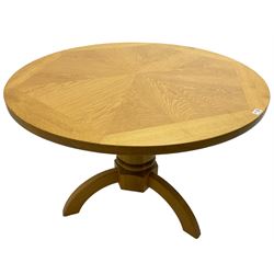 Solid oak dining table, circular top over cylindrical pedestal terminating in three shaped supports