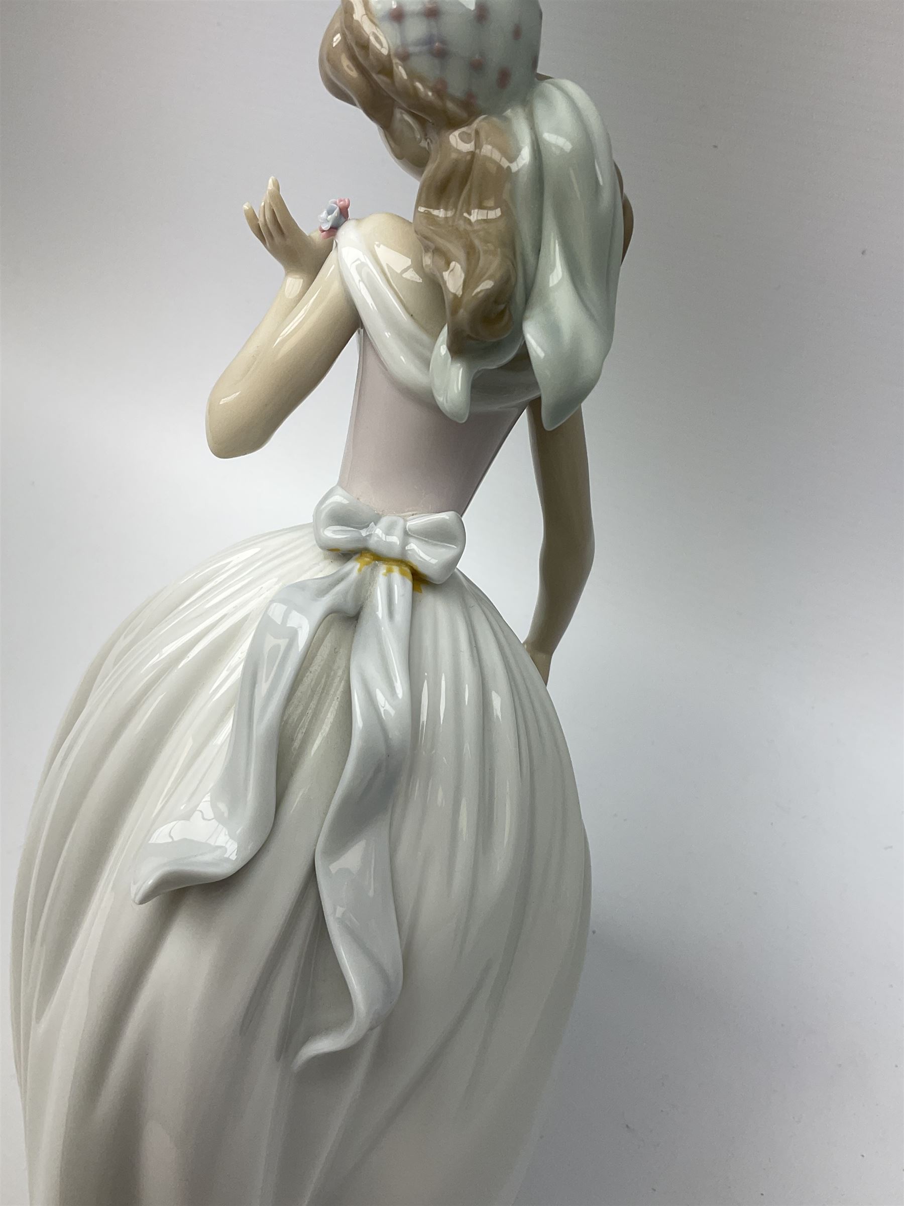 Large Lladro Figures, Spring Splendor, designed by Regino Torrijos, model number 5898, H30.5cm, the glass slipper, designed by Jose Puche, model number 5957, H29cm and Breathless, designed by Juan Ignacio Aliena, model number 6430, H31cm.