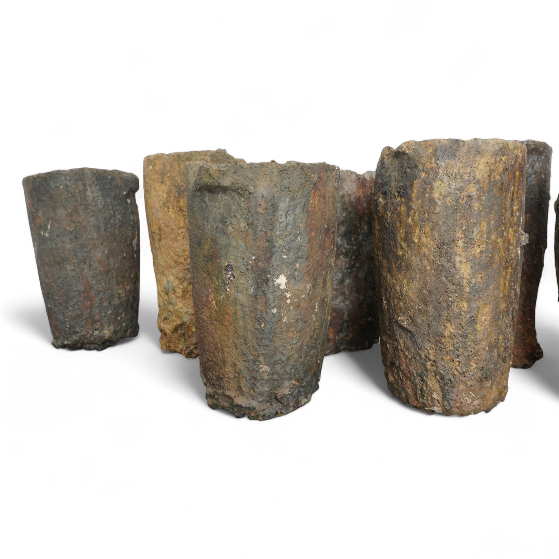 Nine lava stone iron smelting crucible pots in various conditions
