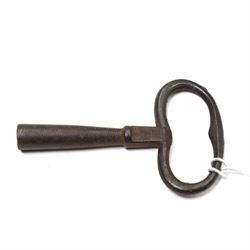 French- early 20th century portico clock garniture, 8-day drum movement decorated with laurel leaves to the glazed bezel and surmounted by a decorative urn with scroll handles, raised by four matching columns on a granite effect oval base with toupee feet, convex enamel dial with gilt pierced hands, Arabic numerals, minute markers and a garland of flowers, twin train Parisian rack striking movement, striking the hours and half hours on a bell. With a sunburst pendulum and key and a matching pair of two-light candelabra.