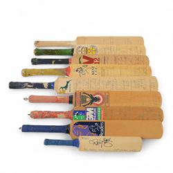 Nine signed miniature cricket bats, each signed by 1990s/2000s County Cricket teams and si...