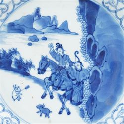 Chinese Kangxi style blue and white plate, decorated to the centre with a hunting scene  of two hunters on horse back, surrounded by a foliate boarder, with with six character double ring mark beneath