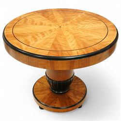 Mid-20th-century Biedermeier-style ebonized and satinwood pedestal table, quarter-veneered circular top with ebonized edge above a tapered baluster quarter-lobed column, raised on a circular plinth base, D87xH70cm, together with two matching upholstered spoon back chairs W45xD47xH87cm