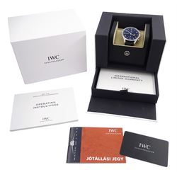 IWC (International Watch Company) Portugieser gentleman's stainless steel automatic chronograph wristwatch, Ref. IW371609, black dial with subsidiary dials at 12 and 6 o'clock for continuous seconds and 30 minute recording, on original black leather strap, boxed with warranty card dated 05.12.2023