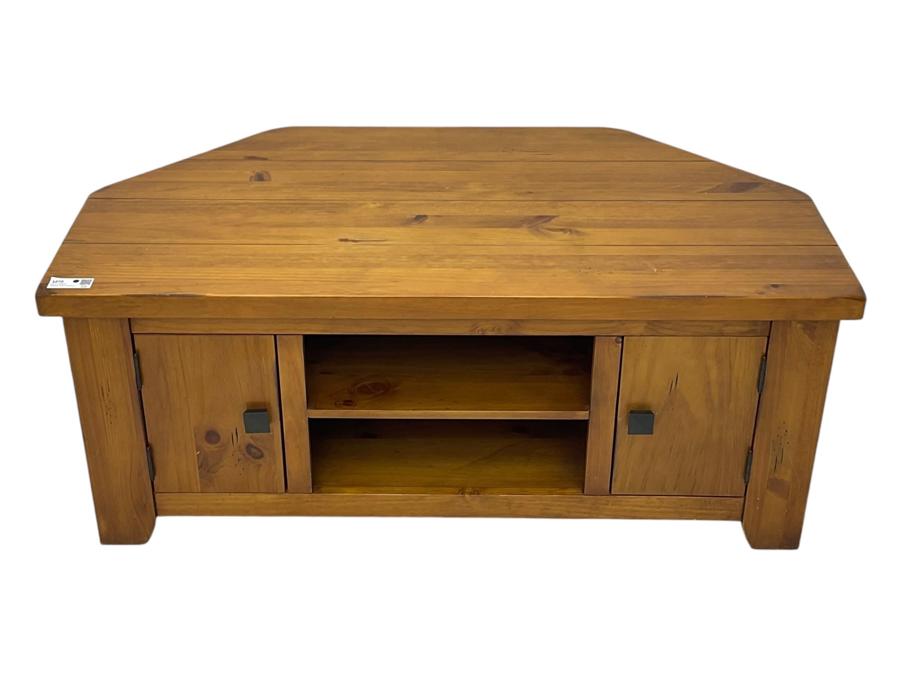 Contemporary mango wood television stand, wide planked surface and angled back corners, central shelving section flanked by twin cupboard doors with square pull handles, raised on stile supports