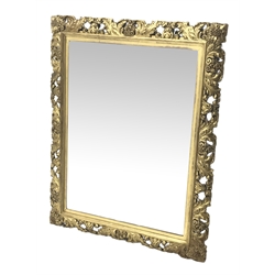  19th century gilt wood and gesso wall mirror, rectangular and upright plate in acanthus scroll pierced and carved frame, W92cm, H114cm  