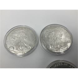 Five United States of America 1oz fine silver one dollar coins, dated 1986, 1987, 1988, 1989 and 1990