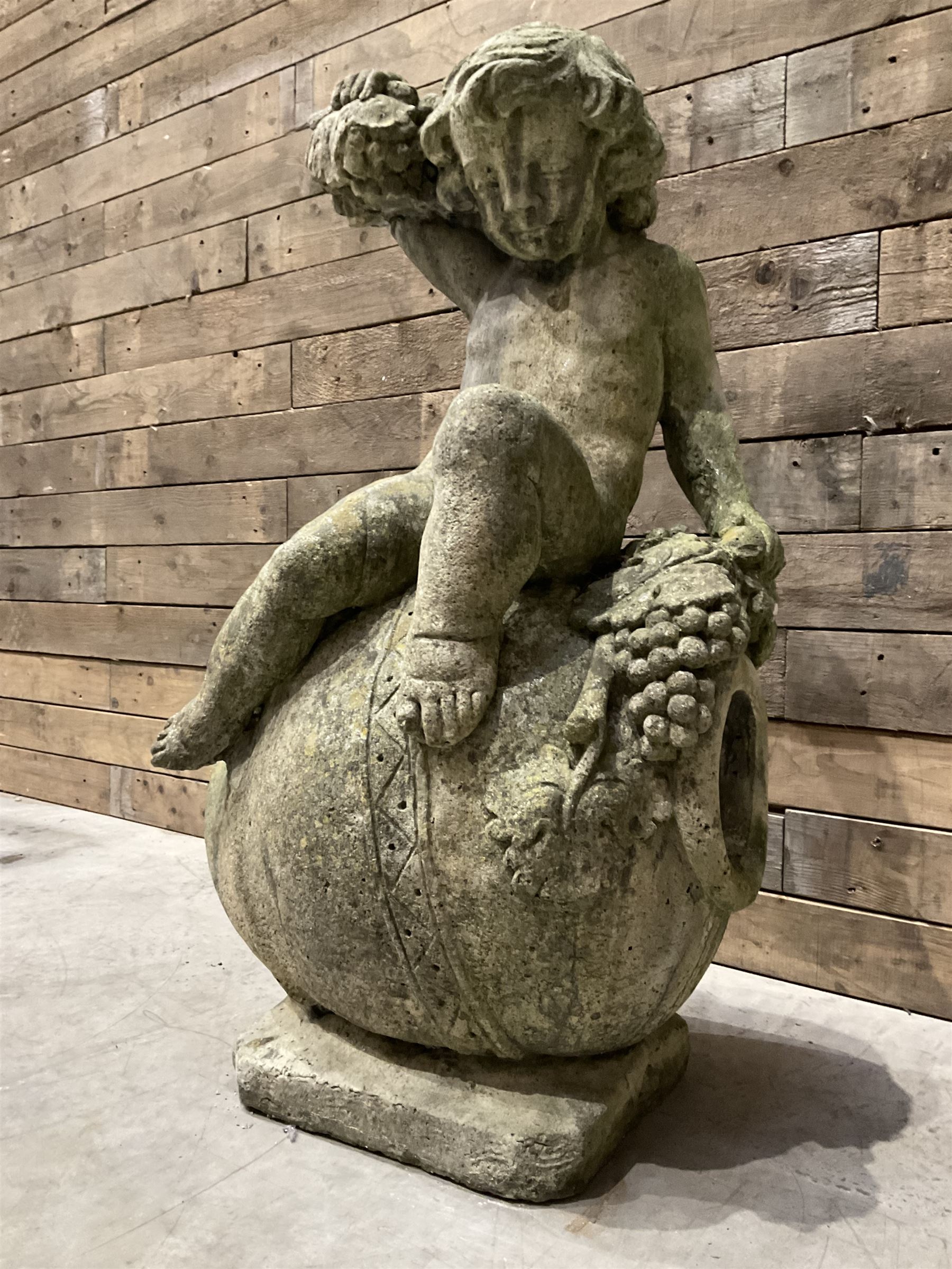 Cast stone garden figure - grape carrier on barrel