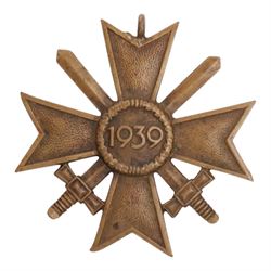 WWI German Hindenburg cross, together WWII bronze Merit Cross with crossed swords, Luftschutz Civil Defence medal and German Wound Badge 
