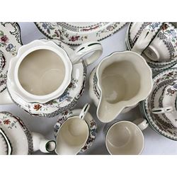 Spode 'Chinese Rose' pattern part tea service comprising two teapots, twin handled lidded sucrier, six teacups and saucers, four larger teacups and saucers, five bowls, milk jug and sugar bowl, mug, six side plates, cake plate and another circular serving plate, all with printed marks beneath