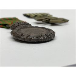 Four French medals - St. Helena medal with bust of Napoleon to obverse and inscription to reverse 'Campagnes de 1792 a 1815. A ses compagnons de gloire sa derniere pensée Ste. Hélène 5 Mai 1821', established by Emperor Napoleon III in 1857; two WW2 Croix-de-Guerre; and WW2 Croix-du-Combattant; all with ribbons (4)