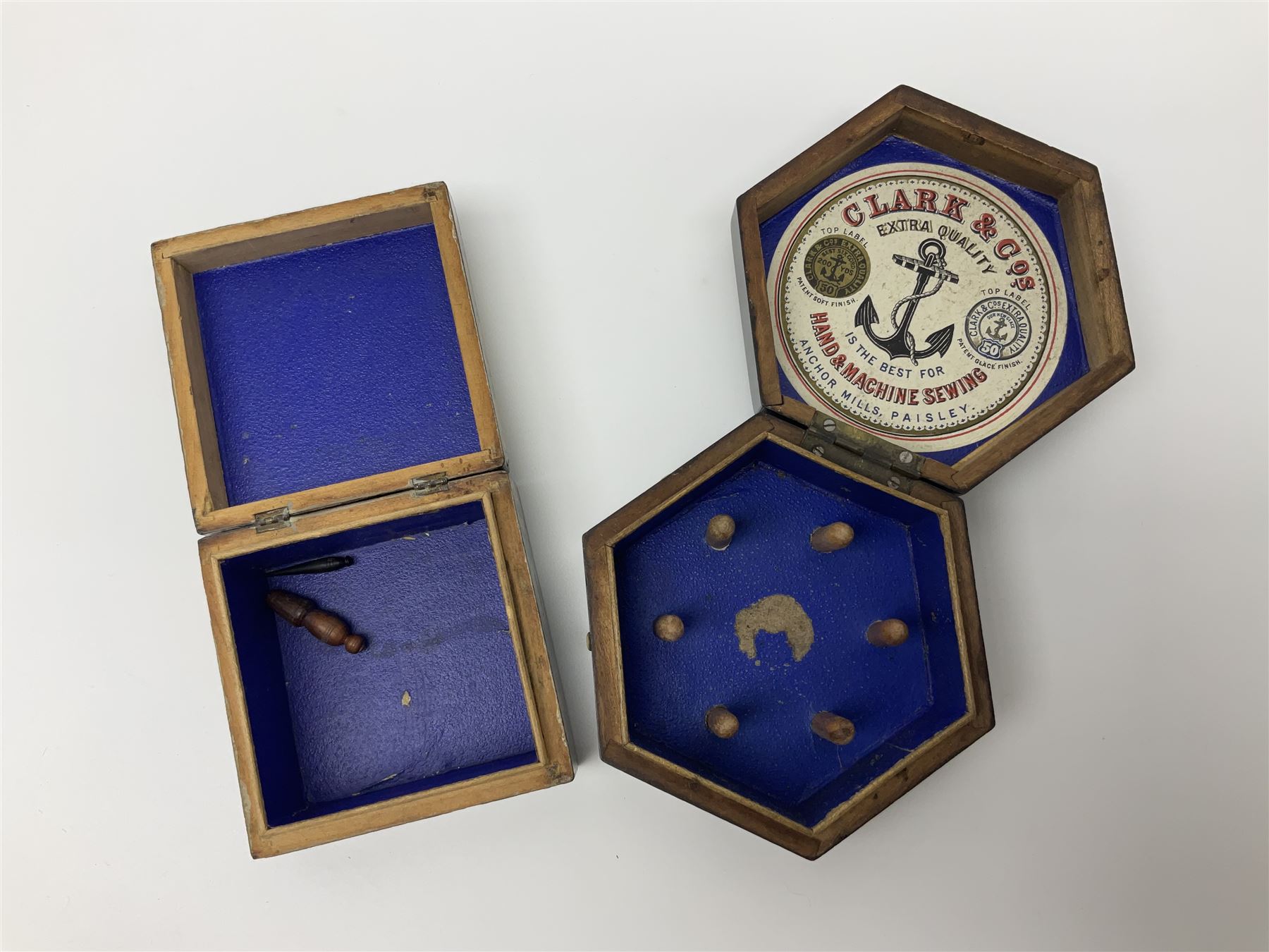 Mauchline ware black lacquered octagonal bobbin box, the hinged cover with forget-me-not floral decoration and sentimental verse, opening to reveal six bobbin holders and retail label for Clark & Co, together with a Mauchline ware sewing box, with floral decoration throughout and verse to hinged cover, a similar black lacquered needle holder and a Mauchline Tartan ware needle holder, largest diameter D11.5cm