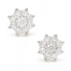 Pair of 18ct white gold diamond flower head earrings, each stud set with nine round brilli...