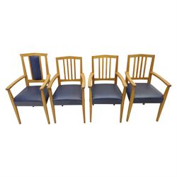 Modern twelve oak dining chairs including one 'Chairmans' chair, solid oak construction, slatted back and arm rests, blue leatherette padded seat, on tapered square supports 