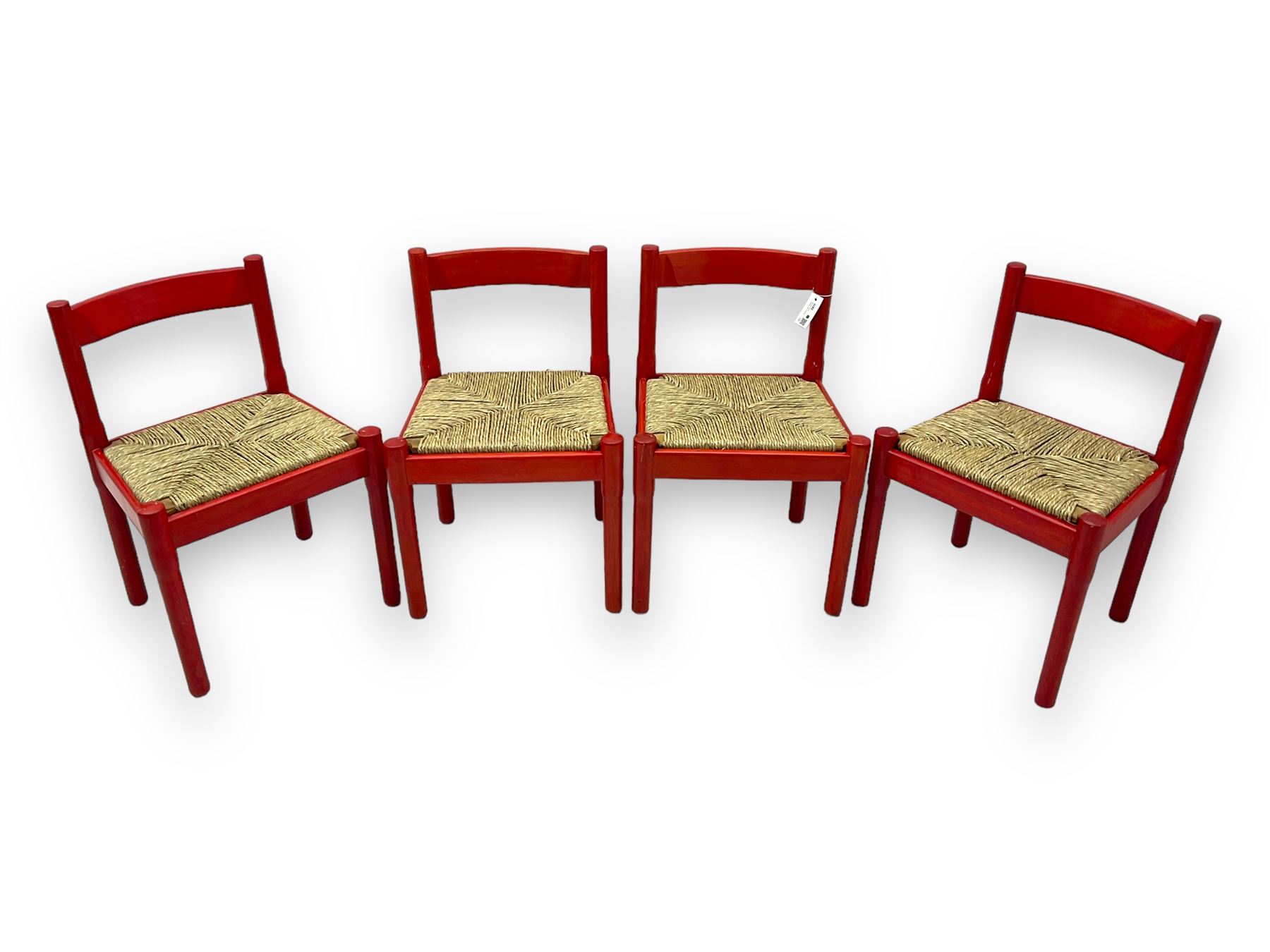 Vico Magistretti - mid-20th century circa. 1970s set of four beech framed dining chairs in red finish, with drop-in rush seats