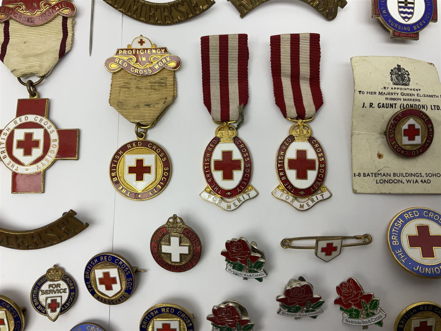 Collection of St John Ambulance enamel and metal badges, together with Red Cross medals and badges