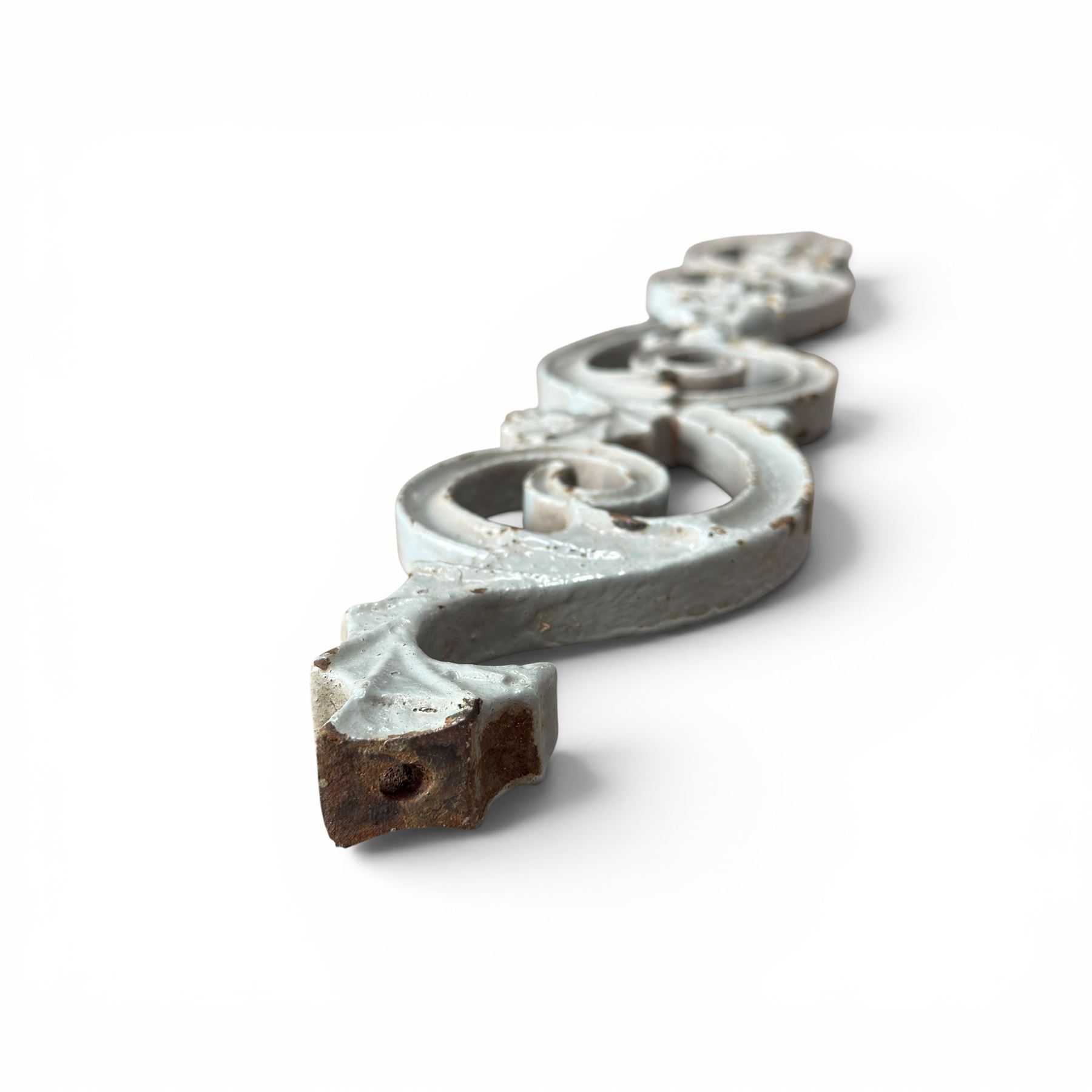 Set of eleven 19th century cast iron ornate stair or banister spindle supports, of scrolling form with scalloped decoration and flower-head motifs, in weathered duck-egg blue painted finish (11)