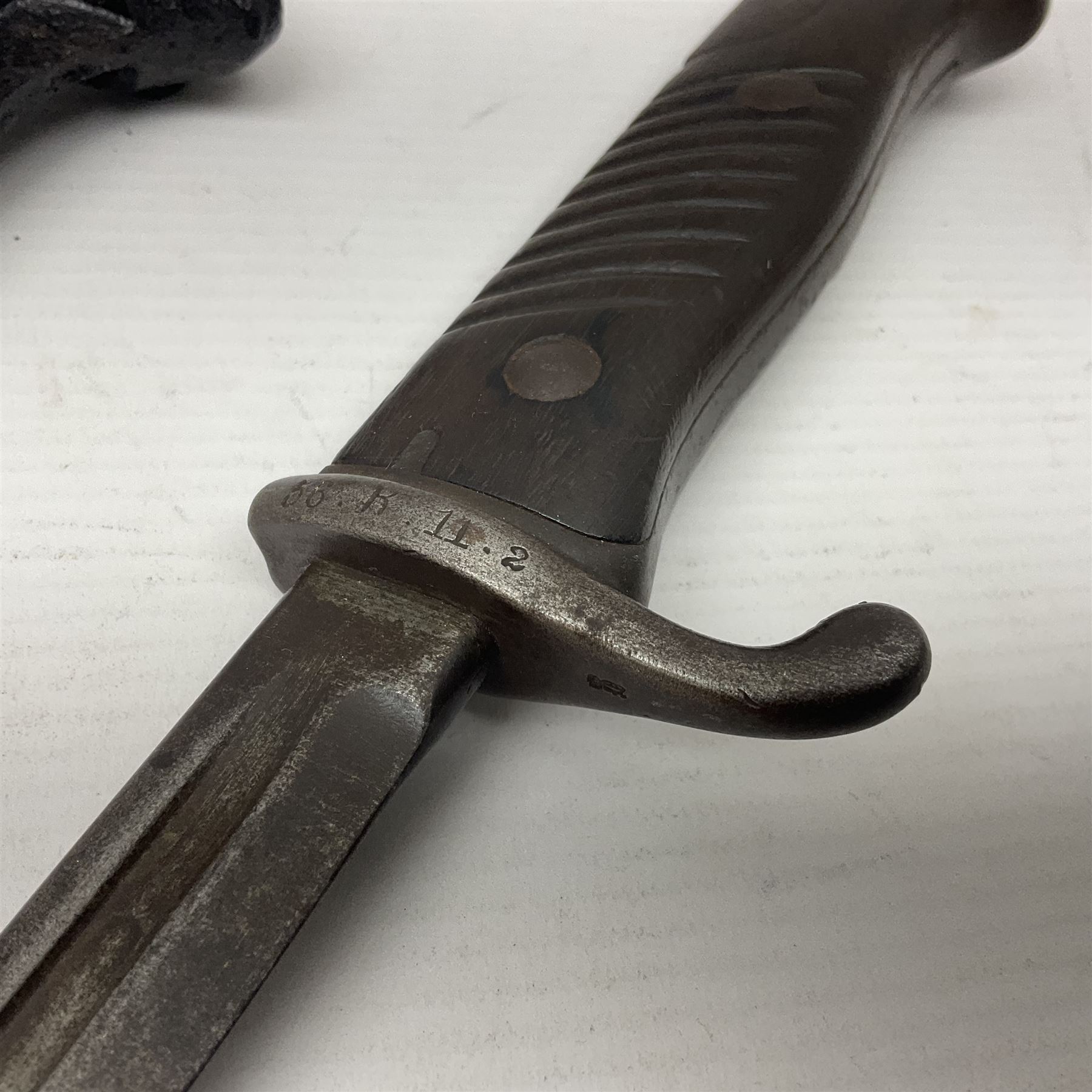 WWI Prussian S98 bayonet with 52cm fullered steel blade dated 1906 to pipeback and marked Solingen to ricasso, regimentally stamped to cross guard 56.R.11.2. for 56 Infanterie Regiment, 11 Kompanie, Waffe 2, L65cm overall; and another in battlefield relic condition (2)