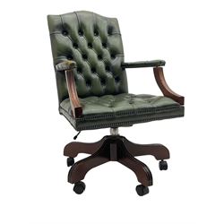Georgian design swivel office desk chair, upholstered in buttoned green leather, on five spoke base with castors 