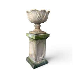 Cast stone five sectional urn on plinth, squat leaf and petal design urn on square base
