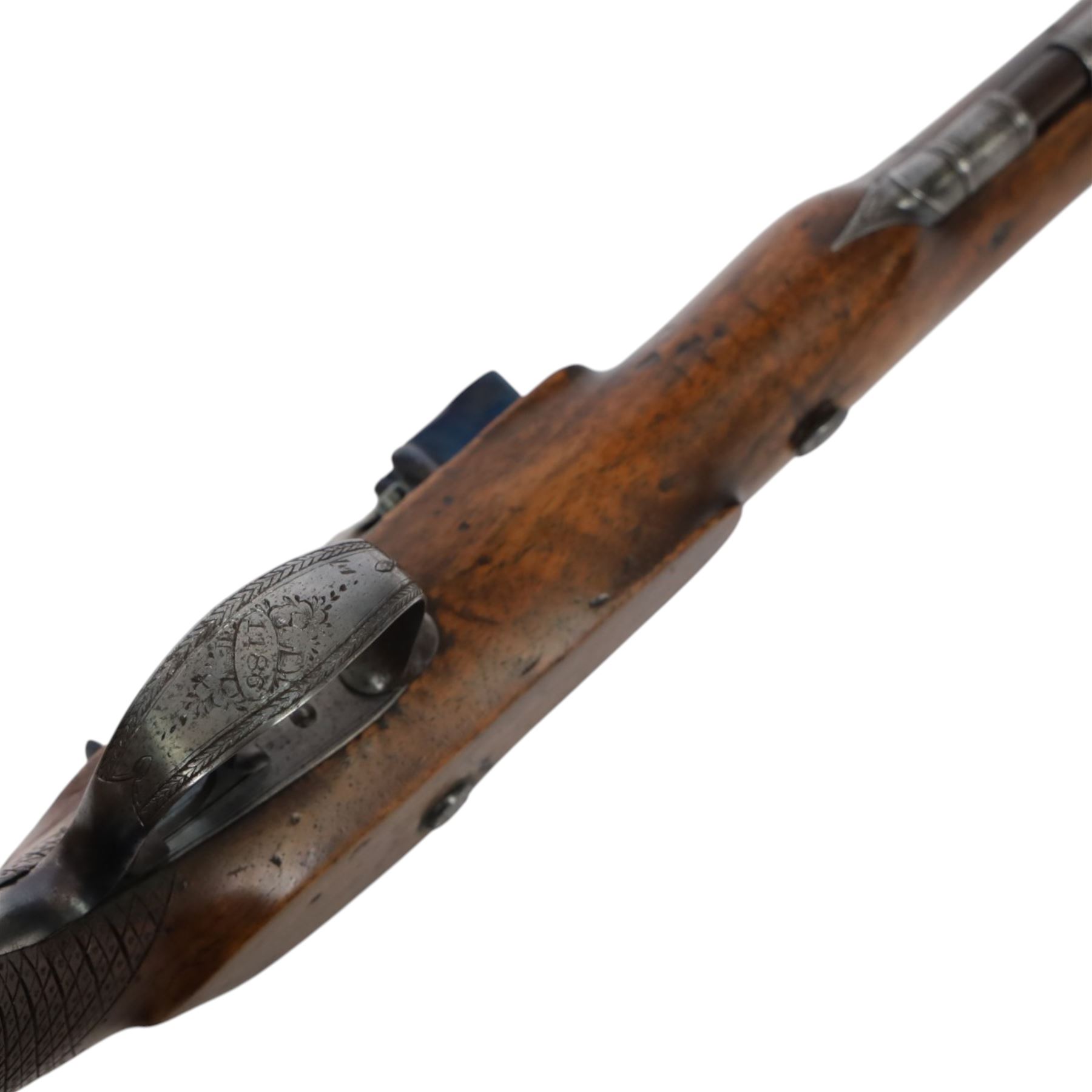 19th century British flintlock pistol by Tatham and Egg, with 21cms Damascus steel sighted barrel with original browning, marked along the top Tatham and Egg London, ramrod beneath, tang and trigger guard engraved with floral scrolls, figured walnut stock with chequered grip and steal butt plate, together with Dixon & Sons Sheffield, three way pistol powder flask, pistol overall L34cm
