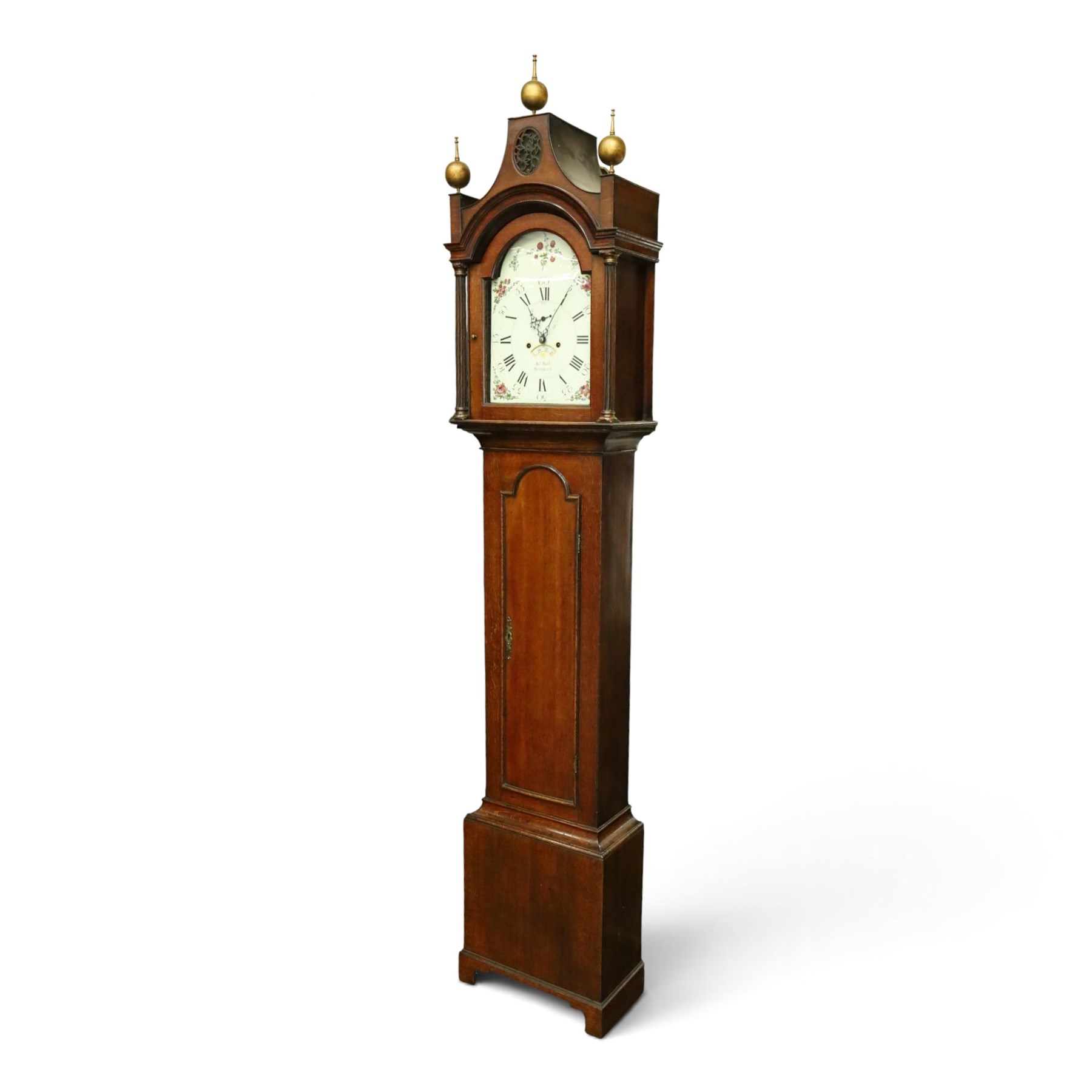 John Hall of Beverley - George III oak eight-day longcase clock, the painted arched dial with subsidiary seconds and date aperture, floral decoration, the case with pagoda top, pierced fretwork panel, brass ball finials, fluted pilasters and arched trunk door