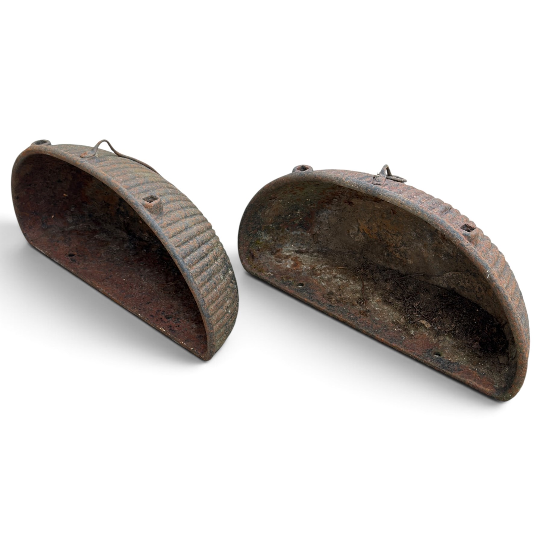 Pair of Victorian wrought iron D-shaped planters, rolled rim over a gadrooned body with fixing holes and ring to the front