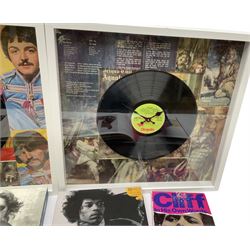 Two novelty framed LP wall clocks; two books containing replica memorabilia and CDs on John Lennon and Jimi Hendrix; Rock Review booklet; and book on Cliff Richard entitled 'Cliff In His Own Words' (6)