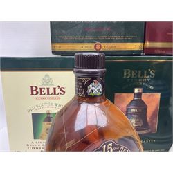 Dimple 15 Year Old Blended Scotch Whisky, together with nine Bells, scotch whisky, in Wade ceramic decanters, including Christmas 1991, 1998, 1996 etc, of various contents and proof 