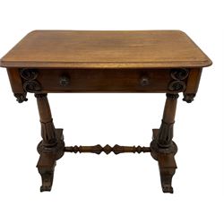 Victorian rosewood stretcher table, moulded rectangular top with rounded corners over single drawer, turned and carved twin pillar supports on platforms joined by turned stretcher, scroll carved feet