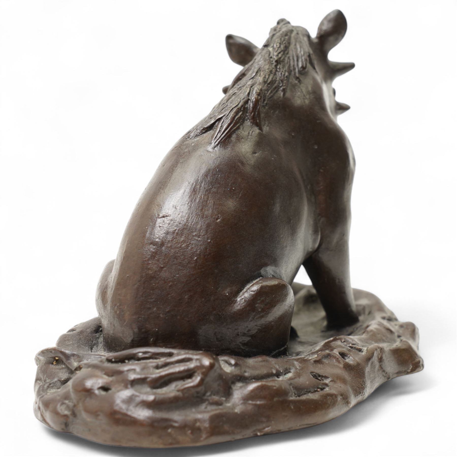 Donald Greig (South African 1959-): Seated Warthog, bronze, signed, 2007, 9cm x 13cm with certificate