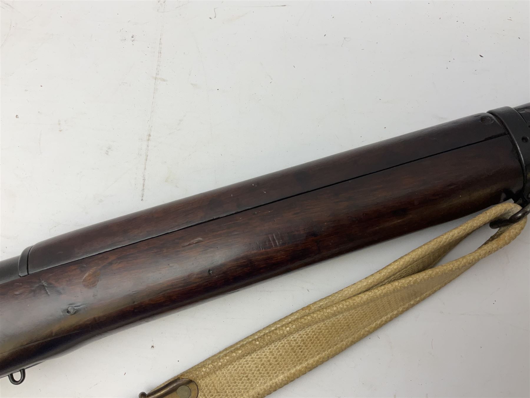 Lee Enfield SMLE .303 No.4 Mk.1* bolt action rifle with 63.5cm barrel and original webbing sling; lacking magazine; No.75C8419; L111cm overall; deactivated to early specification so requires re-deactivation to modern standards SECTION 1 RFD ONLY