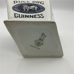 Royal Doulton Guinness advertising whiskey water jug, circa 1930s by Robert Porter and Co. of lozenge angled form, decorated with the  bulldog Guinness, H11cm