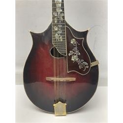 Eastern eight-string mandolin with sunburst finish and mother-of-pearl inlay L68.5cm; and another Harmony mandolin with cracked headstock (2)