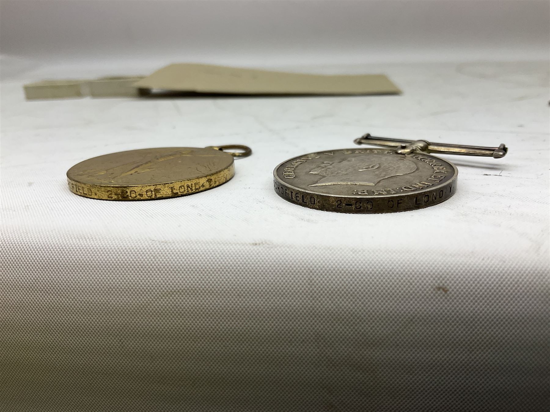 Mostly Great British coins including Queen Victoria 1887 and 1888 crowns, pre-decimal coinage, various five pound coins etc and a WWI War and Victory medal pair named to '16903 PTE. H. SCHOFIELD. 2-CO. OF LOND. Y.'