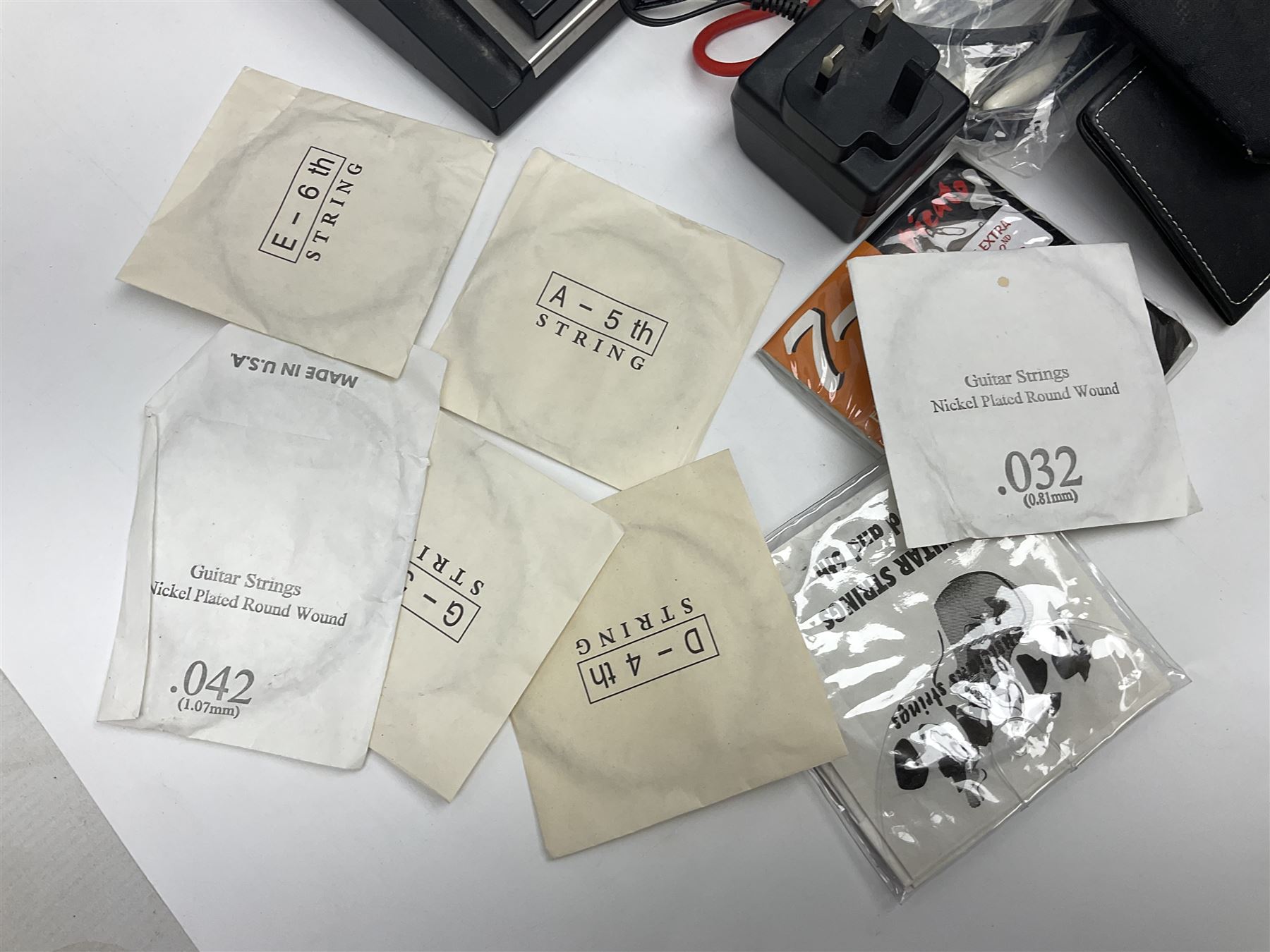 Zoom GFX-4 Guitar Effects processor; quantity of assorted cables; tremolo arms; plectrum wallet; Steepletone SMH10 earphones etc