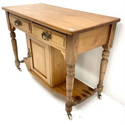 Late Victorian satin walnut wash stand, two drawers, turned supports joined by shaped undertier with single cupboard 