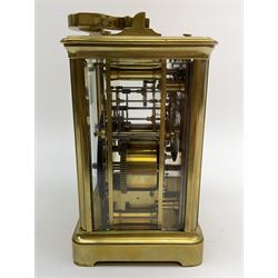 Early to mid 20th century French brass and bevelled glass cased carriage clock, the shaped loop handle over oval glass panel, white enamel Roman dial, twin train driven eight day movement striking on coil, with button push repeater, the movement back plate stamped for 'R & Co.'