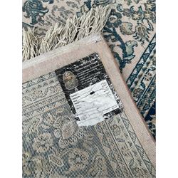 Persian Nain design pale pink and blue ground rug, decorated with scrolling foliage and flower head motifs