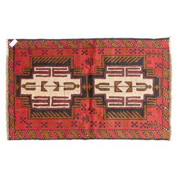 Turkish Anatolian rug, crimson ground, with stepped geometric medallions in ivory, brown, ...