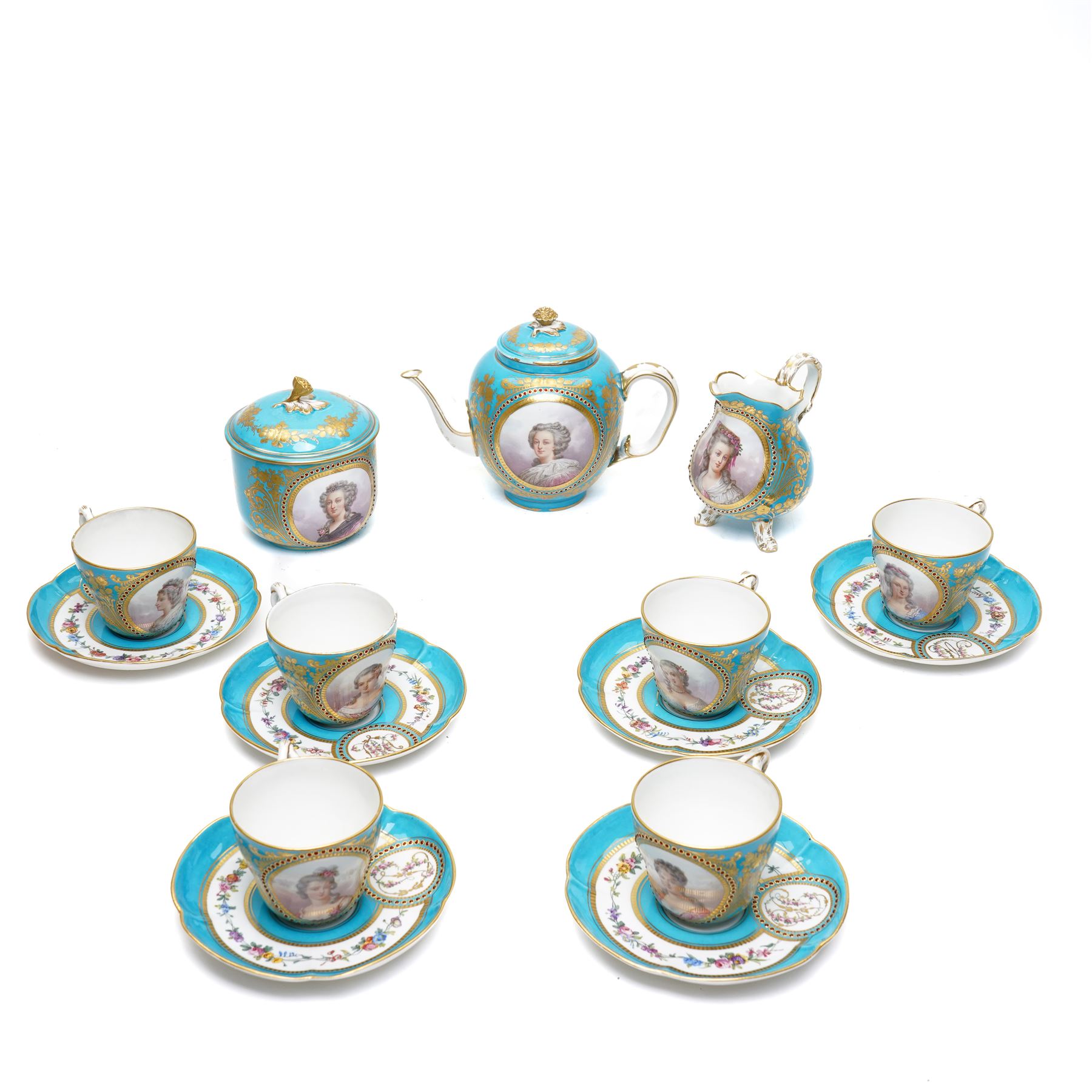 Sevres dejeuner 'Bleu turquoise' tea service for six covers, decorated by Charles-Eloi Asselin, comprising six teacups and saucers, teapot, milk jug and covered sucrier, the bleu de ciel ground painted with portraits of the French courtiers, each piece with name to base (some rubbed) of those depicted, to include Marie Antoinette (teapot), Madame de Montesson, Madame du Barry, Madam de Genlis, Madame Elizabeth (sucrier), Madame de Lamballe (milk jug) Madame Victoire, and two others unidentified, within finely painted gilt surround, each portrait encircled by red jewelled borders, the saucers with corresponding monograms within similar floral gilt and jewelled borders, Sevres mark to base with painted 'ee', dating these 1782, teapot H14cm 