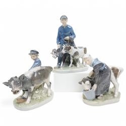 Three Royal Copenhagen figures, including Boy leading two Calves no. 1858, Boy with Calf n...